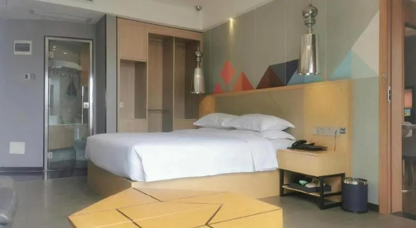 Bed in Borrman Hotel Zhaoqing Sihui Tianguangxu Jade City