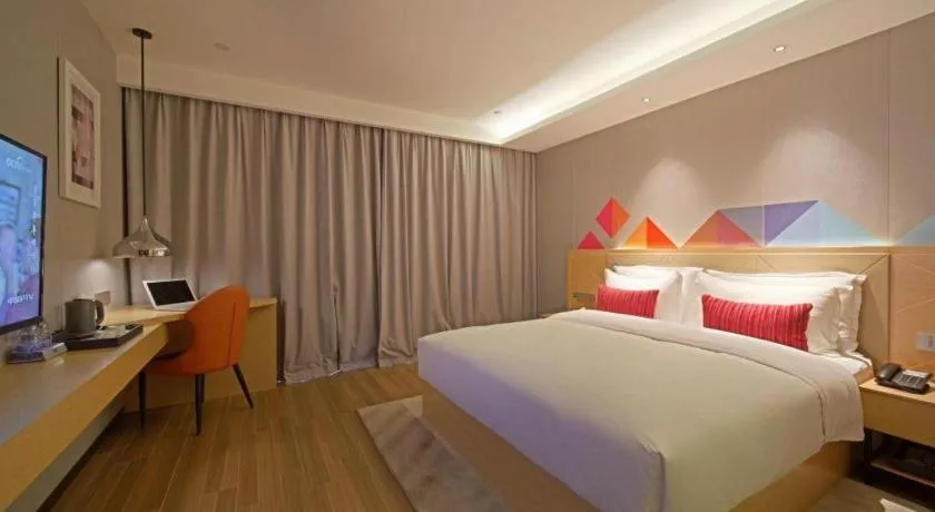 Bed in Borrman Hotel Zhaoqing Sihui Tianguangxu Jade City