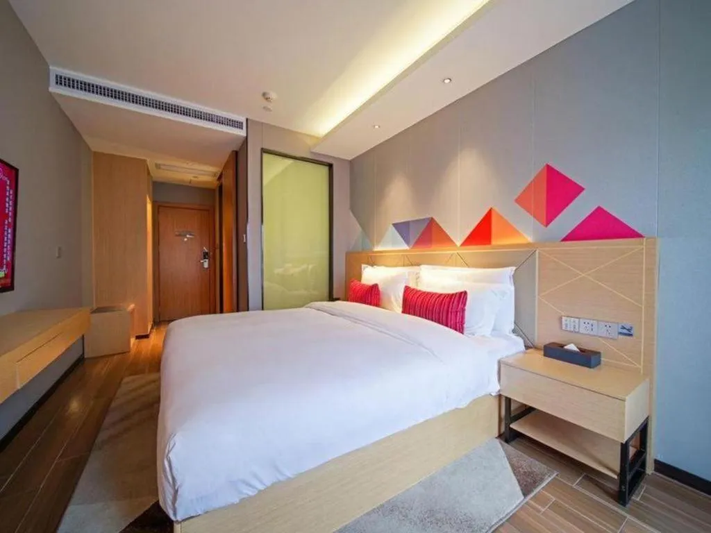 Bed in Borrman Hotel Zhaoqing Sihui Tianguangxu Jade City