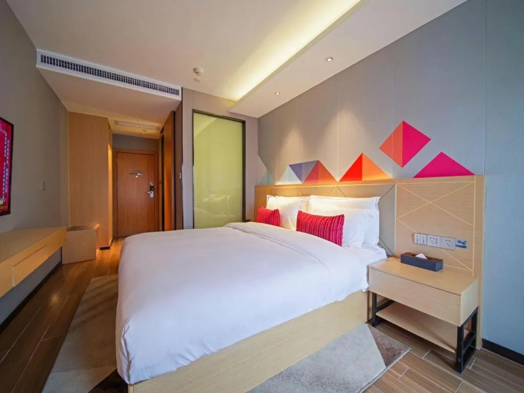 Bed in Borrman Hotel Zhaoqing Sihui Tianguangxu Jade City