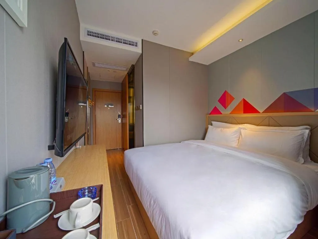 Bed in Borrman Hotel Zhaoqing Sihui Tianguangxu Jade City