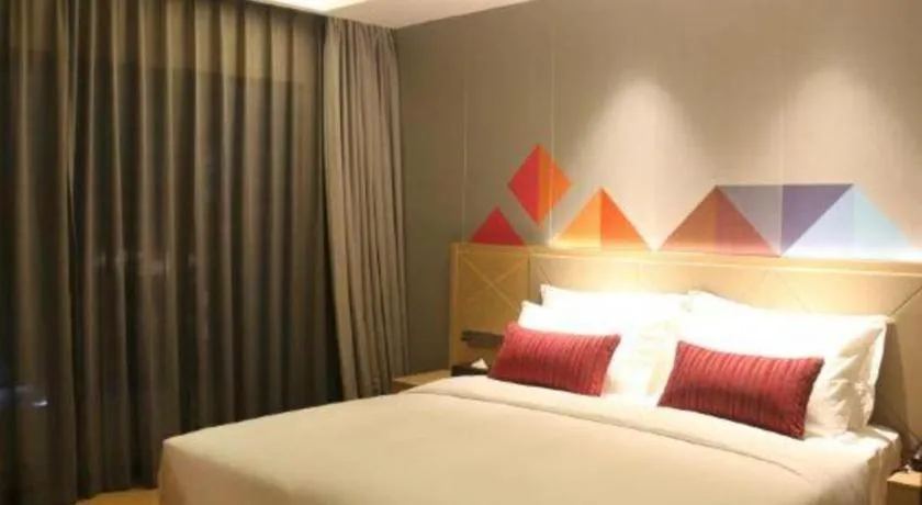 Bed in Borrman Hotel Zhaoqing Sihui Tianguangxu Jade City