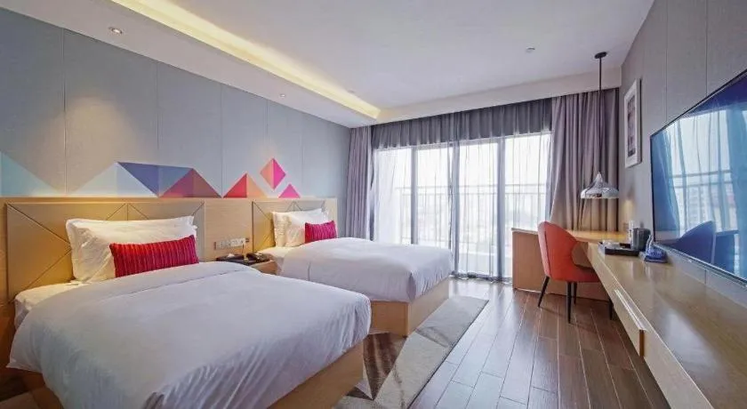 Bed in Borrman Hotel Zhaoqing Sihui Tianguangxu Jade City