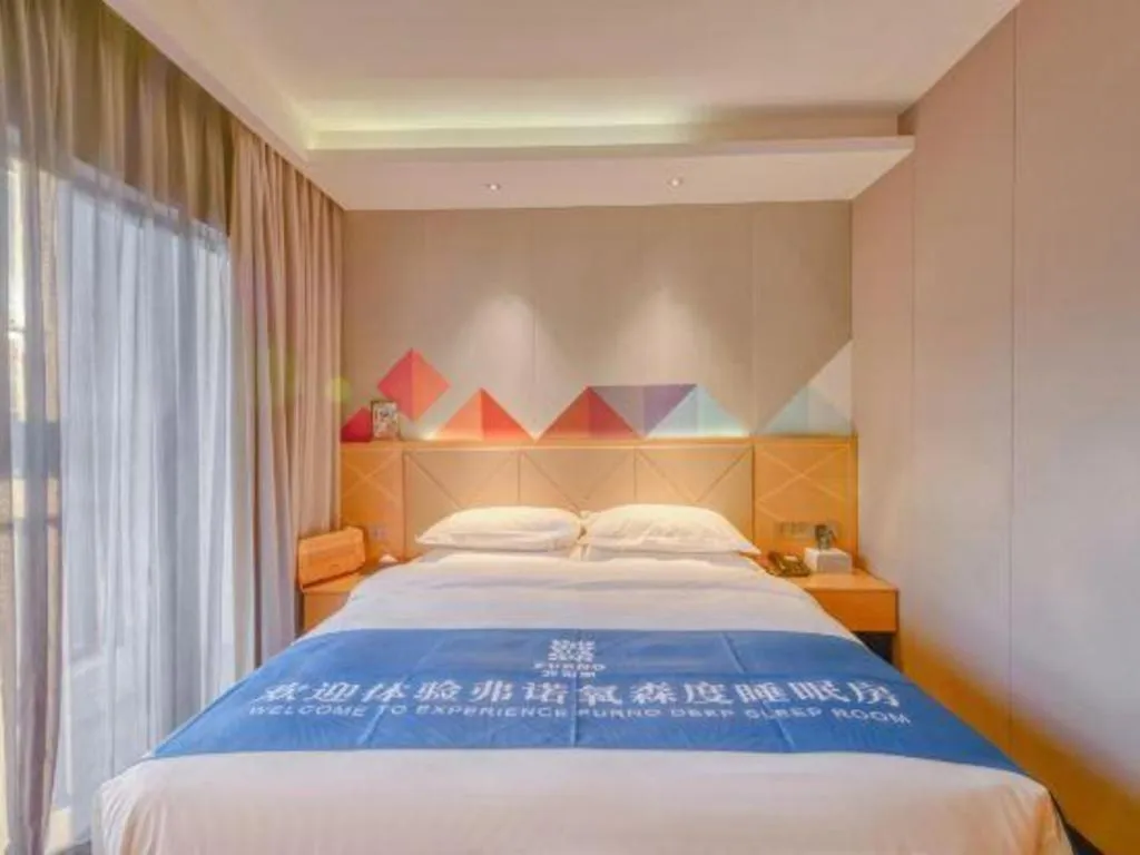 Bed in Borrman Hotel Zhaoqing Sihui Tianguangxu Jade City