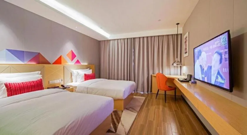 Bed in Borrman Hotel Zhaoqing Sihui Tianguangxu Jade City