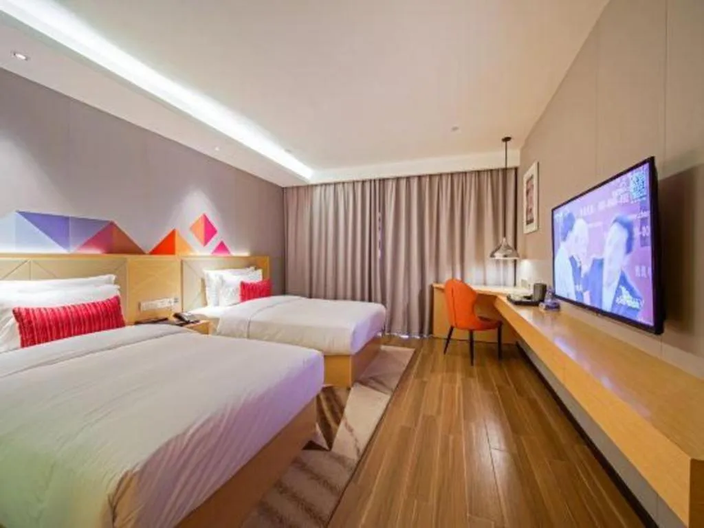 Bed in Borrman Hotel Zhaoqing Sihui Tianguangxu Jade City