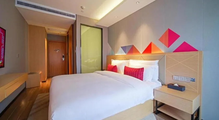 Bed in Borrman Hotel Zhaoqing Sihui Tianguangxu Jade City