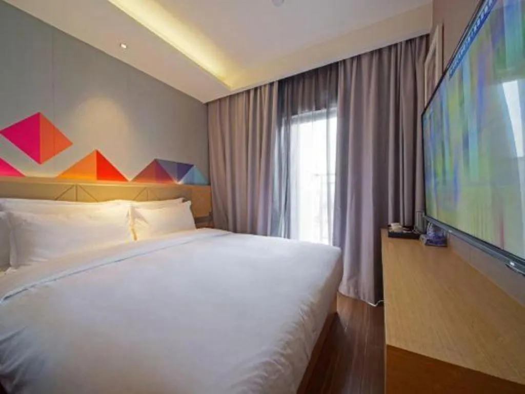 Bed in Borrman Hotel Zhaoqing Sihui Tianguangxu Jade City