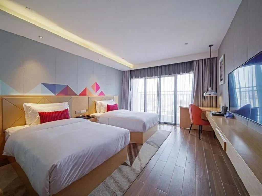 Bed in Borrman Hotel Zhaoqing Sihui Tianguangxu Jade City