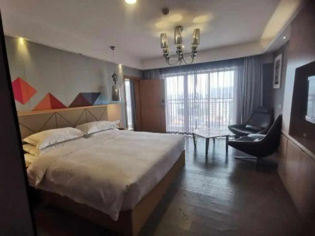 Bed in Borrman Hotel Zhaoqing Sihui Tianguangxu Jade City