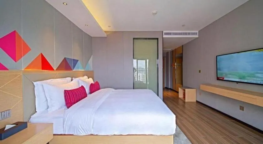 Bed in Borrman Hotel Zhaoqing Sihui Tianguangxu Jade City