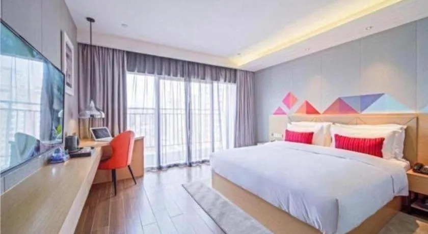 Bed in Borrman Hotel Zhaoqing Sihui Tianguangxu Jade City