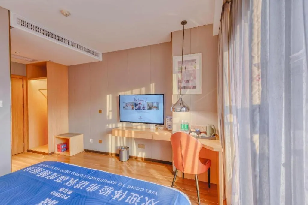 Bed in Borrman Hotel Zhaoqing Sihui Tianguangxu Jade City