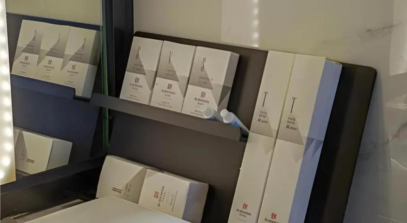 Bed in Borrman Hotel Zhaoqing Sihui Tianguangxu Jade City