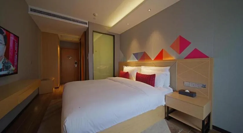 Bed in Borrman Hotel Zhaoqing Sihui Tianguangxu Jade City