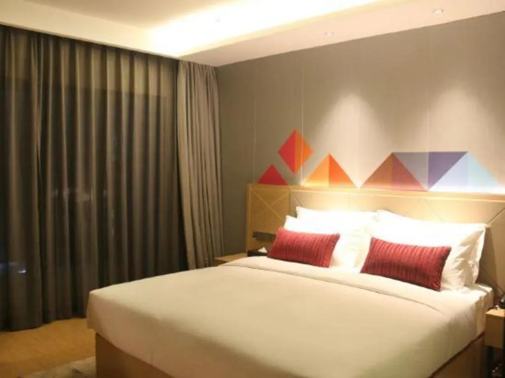 Bed in Borrman Hotel Zhaoqing Sihui Tianguangxu Jade City