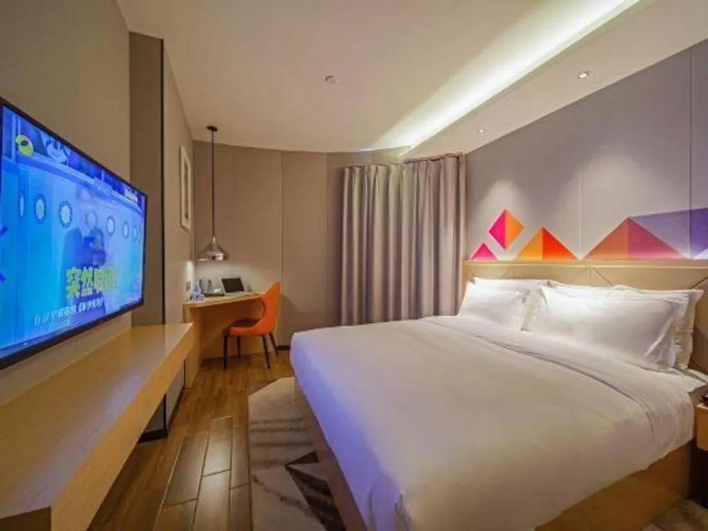 Bed in Borrman Hotel Zhaoqing Sihui Tianguangxu Jade City