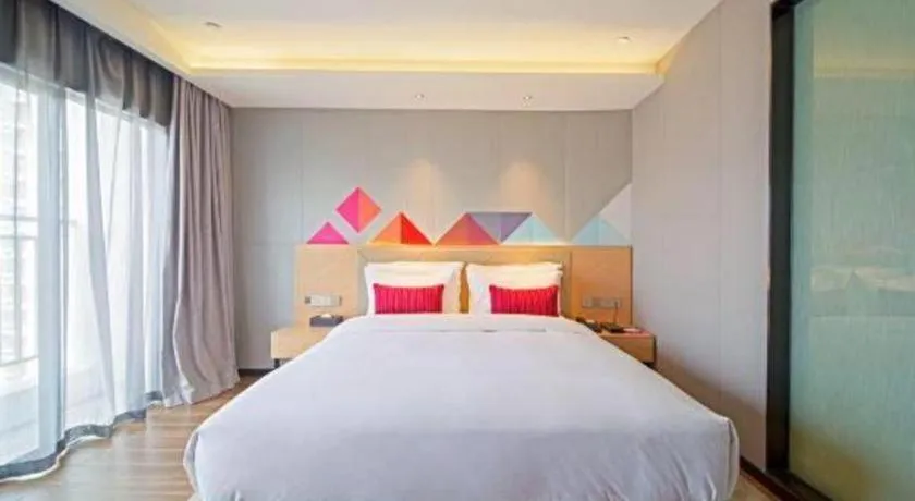 Bed in Borrman Hotel Zhaoqing Sihui Tianguangxu Jade City