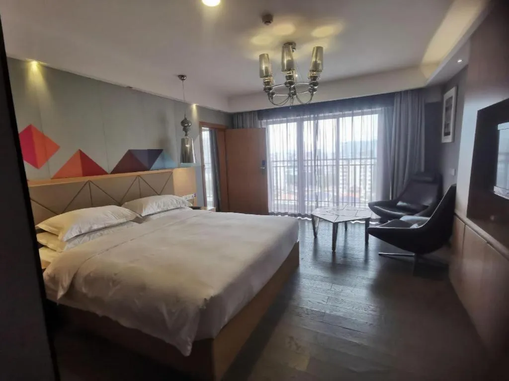 Bed in Borrman Hotel Zhaoqing Sihui Tianguangxu Jade City