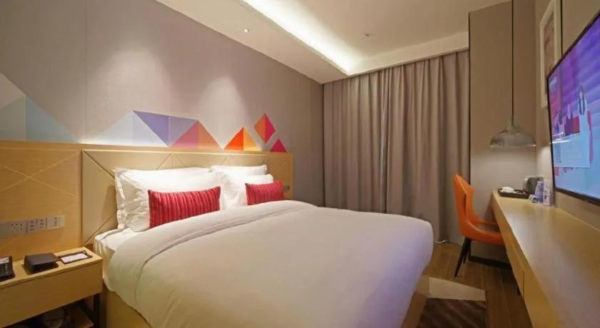 Bed in Borrman Hotel Zhaoqing Sihui Tianguangxu Jade City