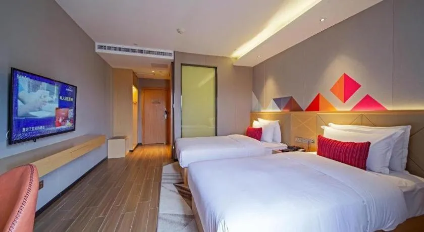 Bed in Borrman Hotel Zhaoqing Sihui Tianguangxu Jade City