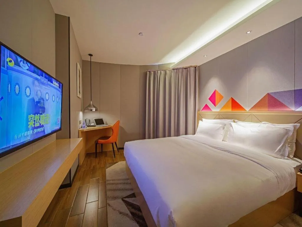 Bed in Borrman Hotel Zhaoqing Sihui Tianguangxu Jade City