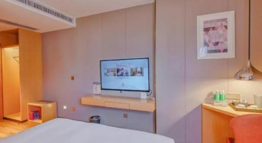 Bed in Borrman Hotel Zhaoqing Sihui Tianguangxu Jade City