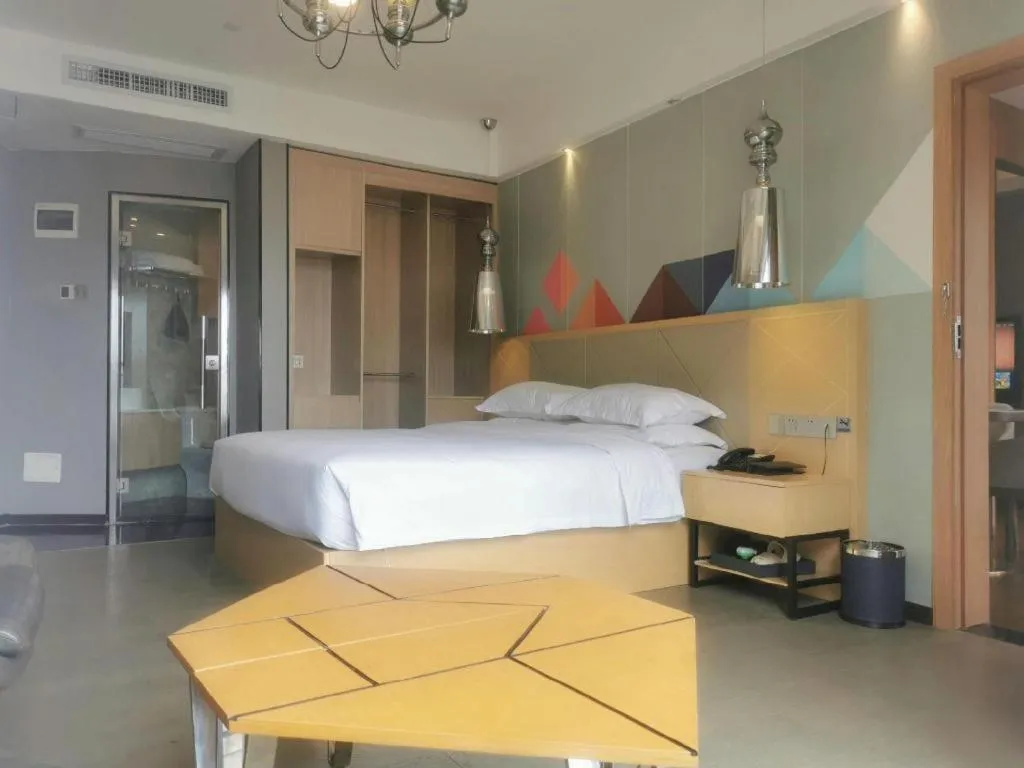 Bed in Borrman Hotel Zhaoqing Sihui Tianguangxu Jade City