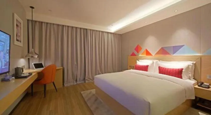 Bed in Borrman Hotel Zhaoqing Sihui Tianguangxu Jade City