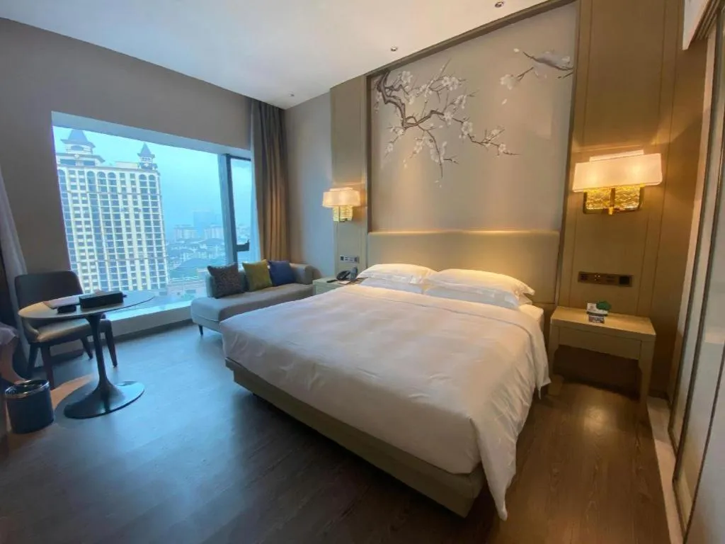 Bed in Derayco Hotel Foshan