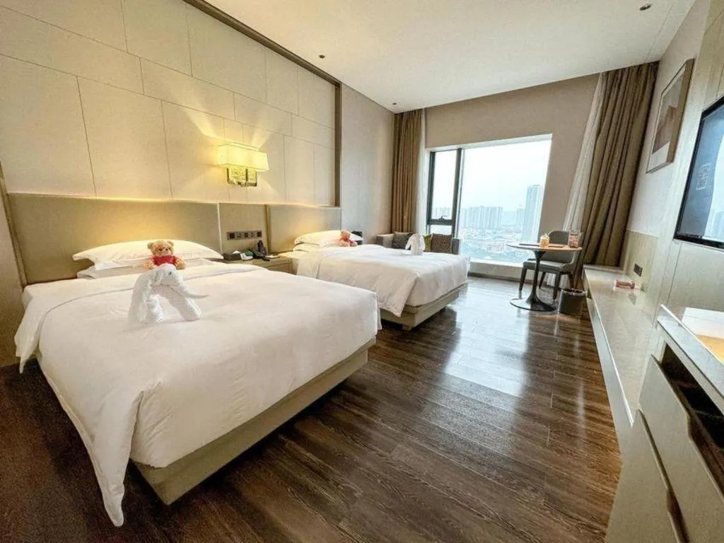 Bed in Derayco Hotel Foshan