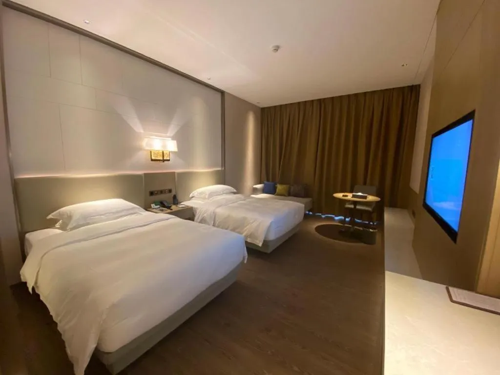 Bed in Derayco Hotel Foshan