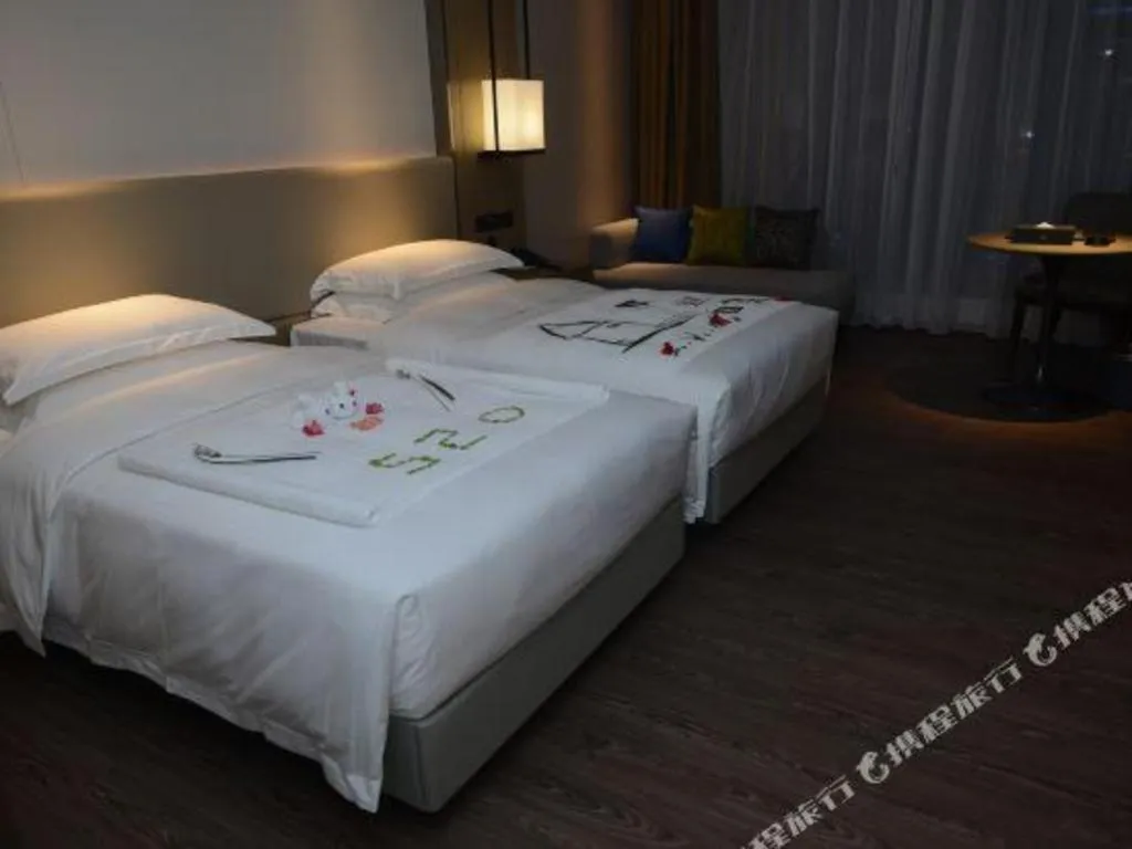 Bed in Derayco Hotel Foshan