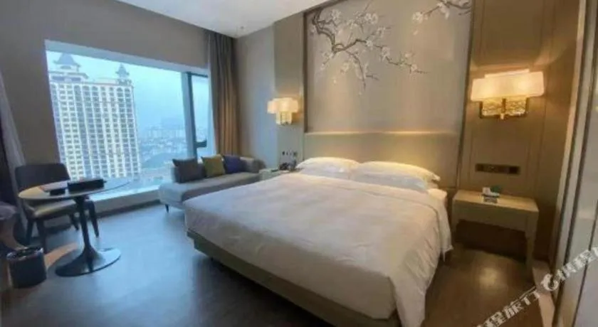 Bed in Derayco Hotel Foshan