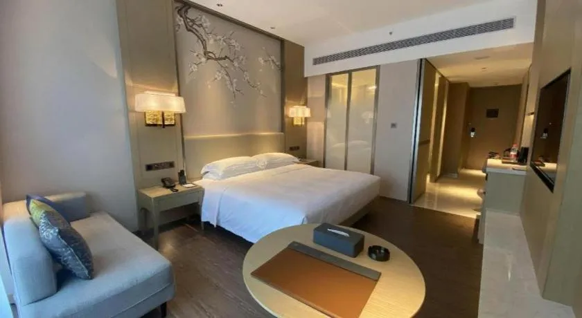 Bed in Derayco Hotel Foshan