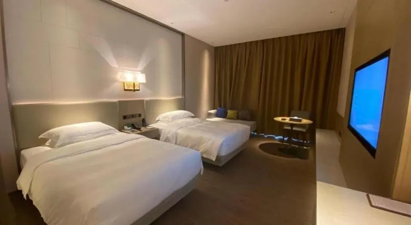 Bed in Derayco Hotel Foshan