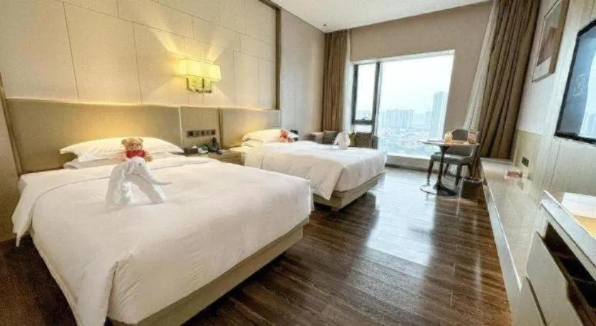 Bed in Derayco Hotel Foshan