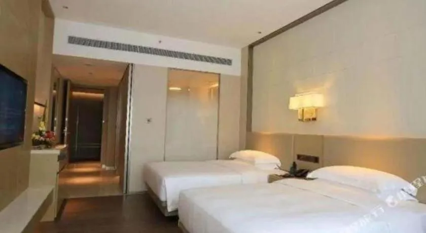 Bed in Derayco Hotel Foshan