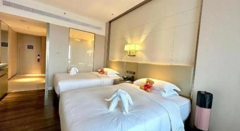 Bed in Derayco Hotel Foshan
