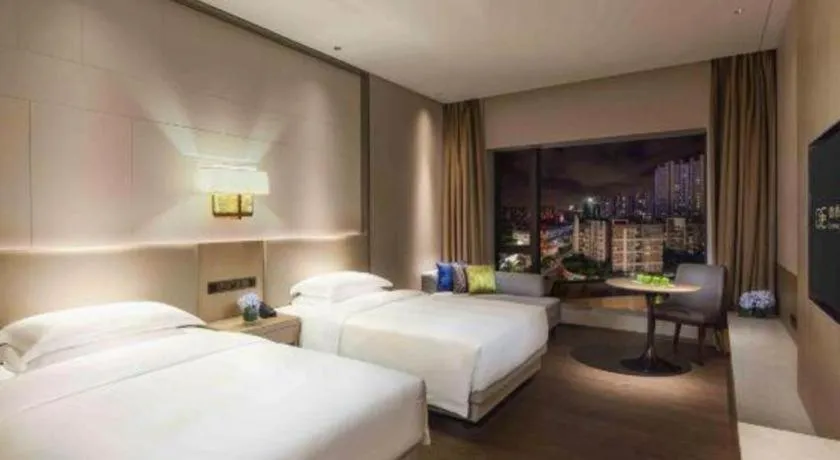 Bed in Derayco Hotel Foshan