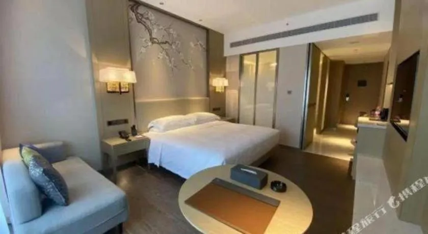 Bed in Derayco Hotel Foshan