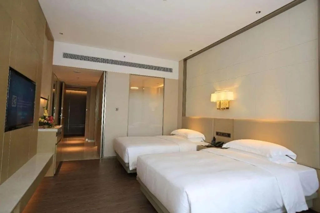 Bed in Derayco Hotel Foshan