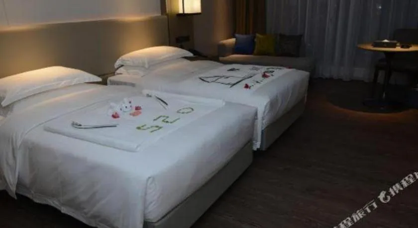 Bed in Derayco Hotel Foshan