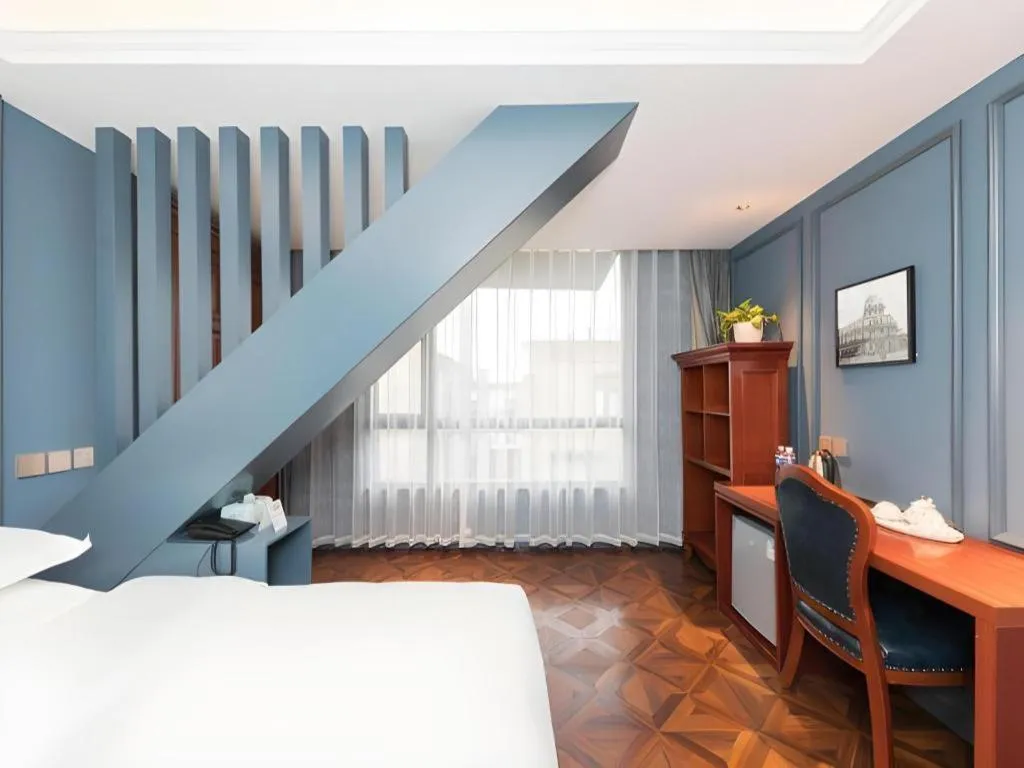 Bed in Yitingzhenshe Hotel Beijing Qianmen