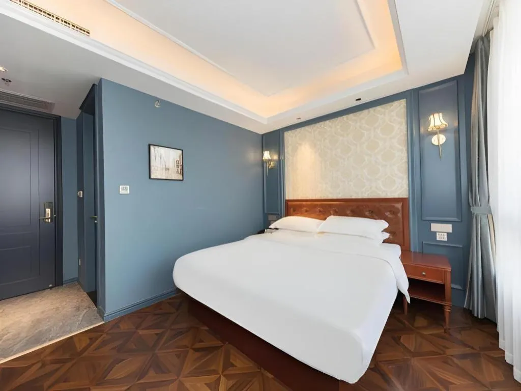 Bed in Yitingzhenshe Hotel Beijing Qianmen