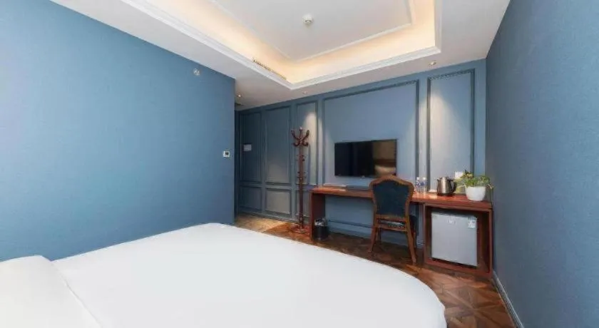 Bed in Yitingzhenshe Hotel Beijing Qianmen