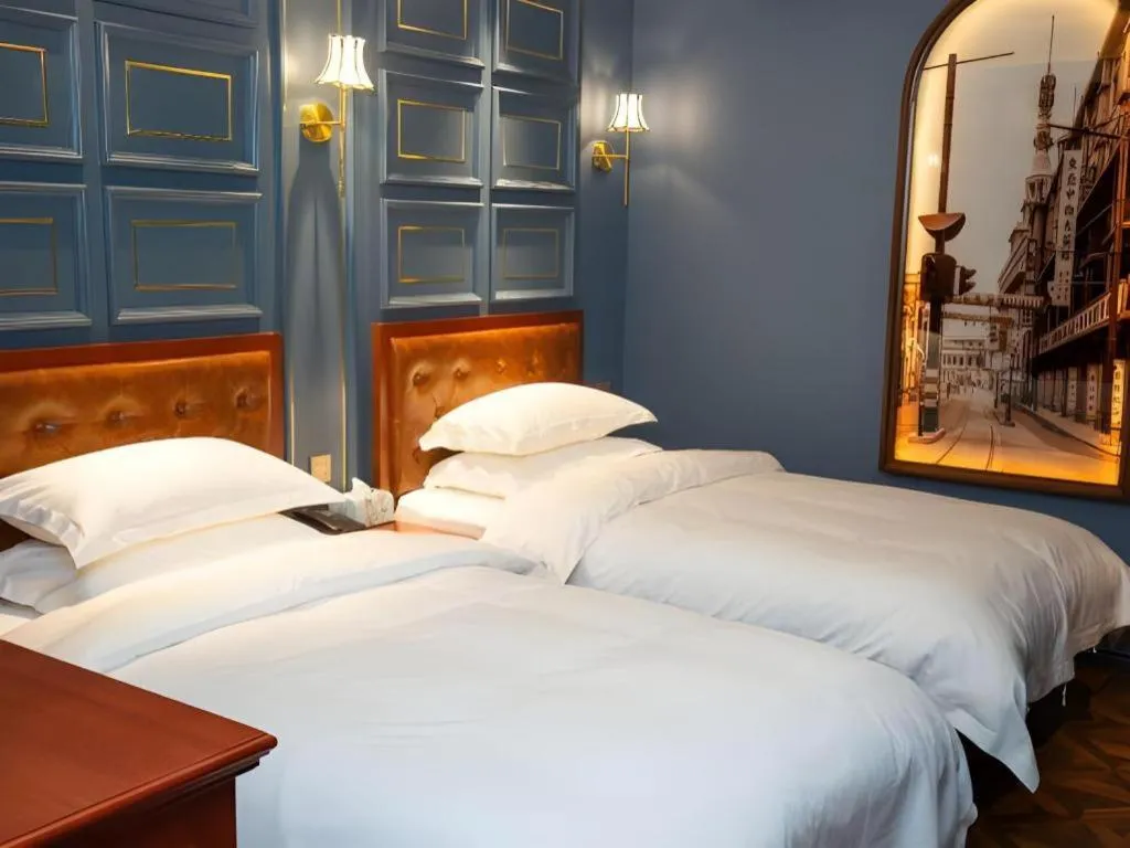 Bed in Yitingzhenshe Hotel Beijing Qianmen