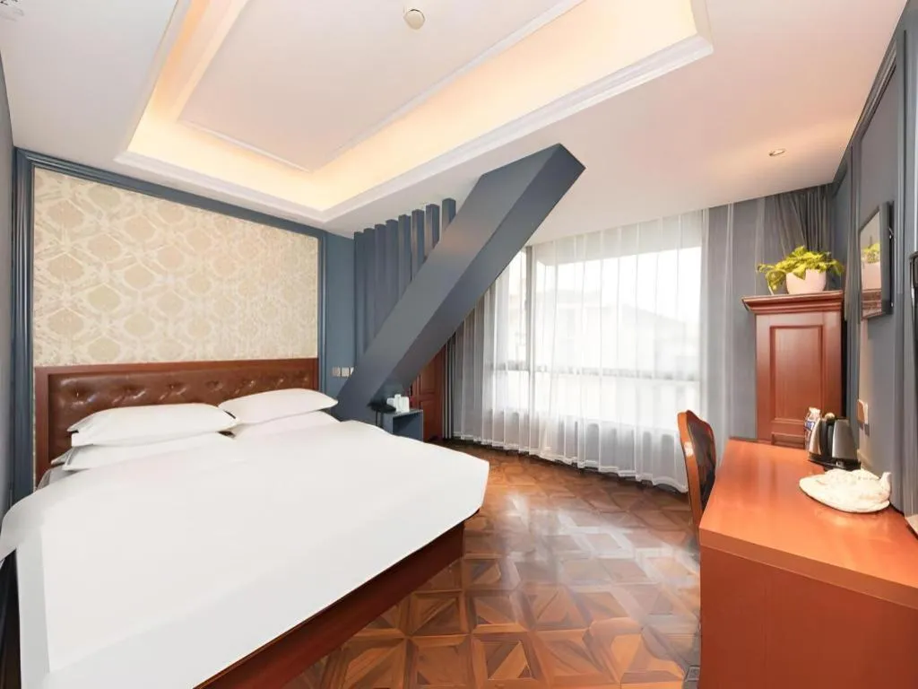 Bed in Yitingzhenshe Hotel Beijing Qianmen