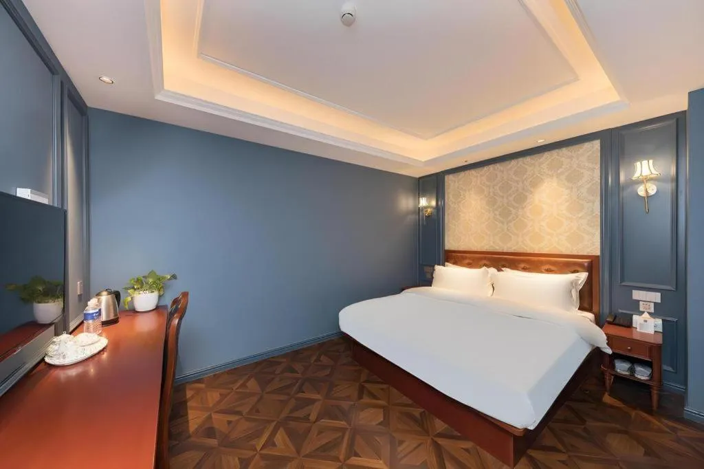 Bed in Yitingzhenshe Hotel Beijing Qianmen