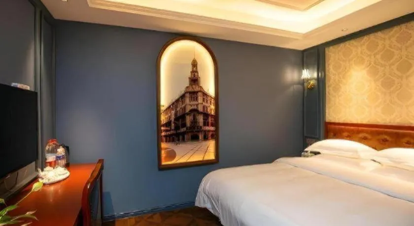 Bed in Yitingzhenshe Hotel Beijing Qianmen